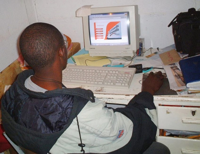 How it all began. Tichawangana building one of his first client websites, Harare, circa 2000